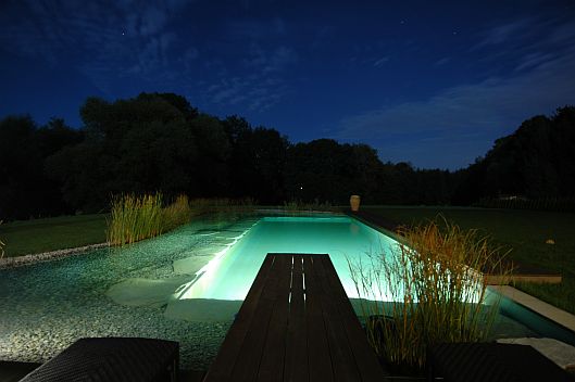 Beautiful natural swimming pool at night