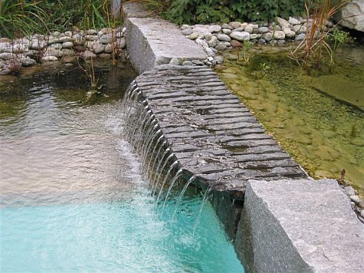 Natural swimming pool and pond water fall